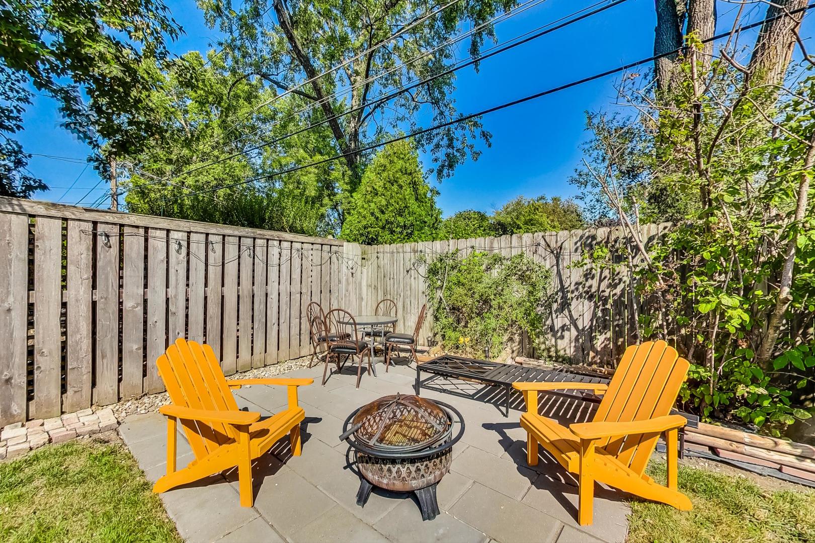 1738 Morse Avenue Des Plaines, IL 60018 - Photo 26 of 31 a backyard of a house with table and chairs