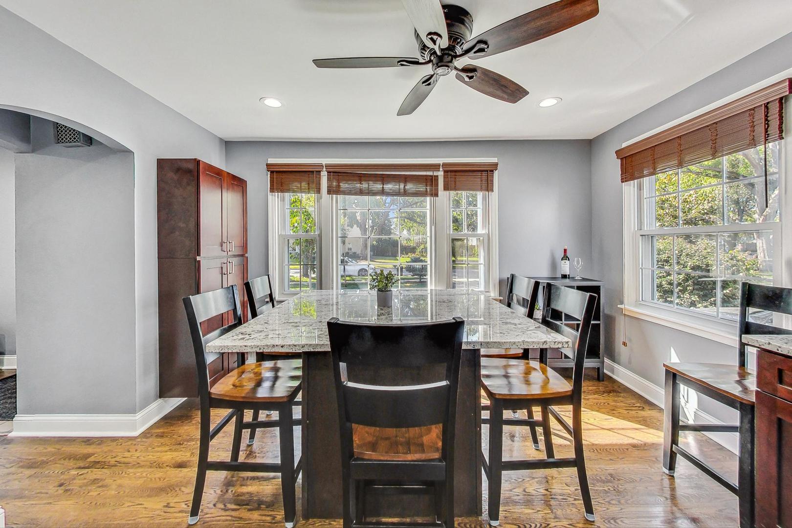 1738 Morse Avenue Des Plaines, IL 60018 - Photo 3 of 31 a view of a dining room with furniture window and outside view