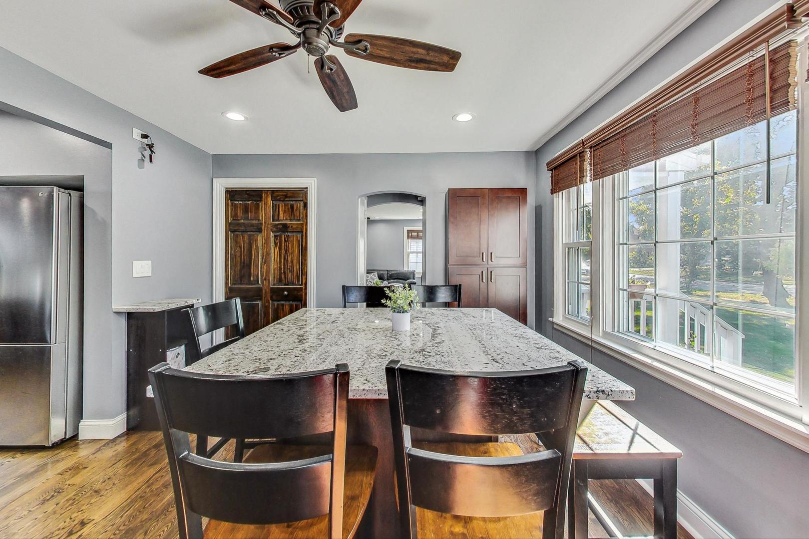 1738 Morse Avenue Des Plaines, IL 60018 - Photo 6 of 31 a view of a dining room with furniture window and wooden floor