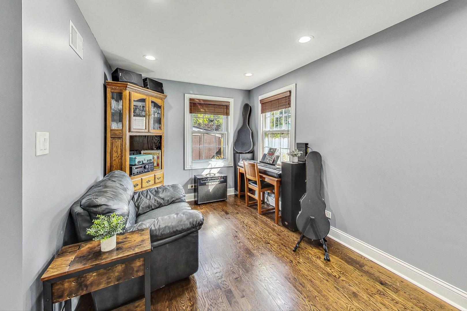 1738 Morse Avenue Des Plaines, IL 60018 - Photo 8 of 31 a living room with furniture window and a wooden floor