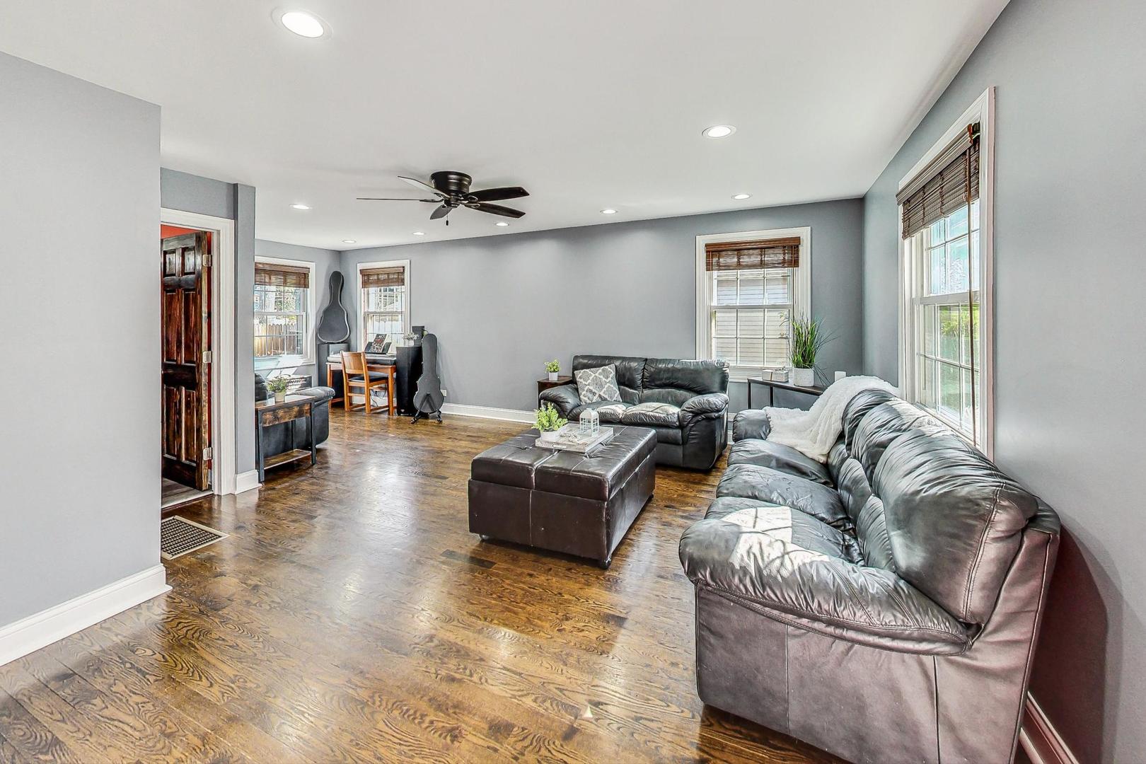 1738 Morse Avenue Des Plaines, IL 60018 - Photo 9 of 31 a living room with furniture and a large window