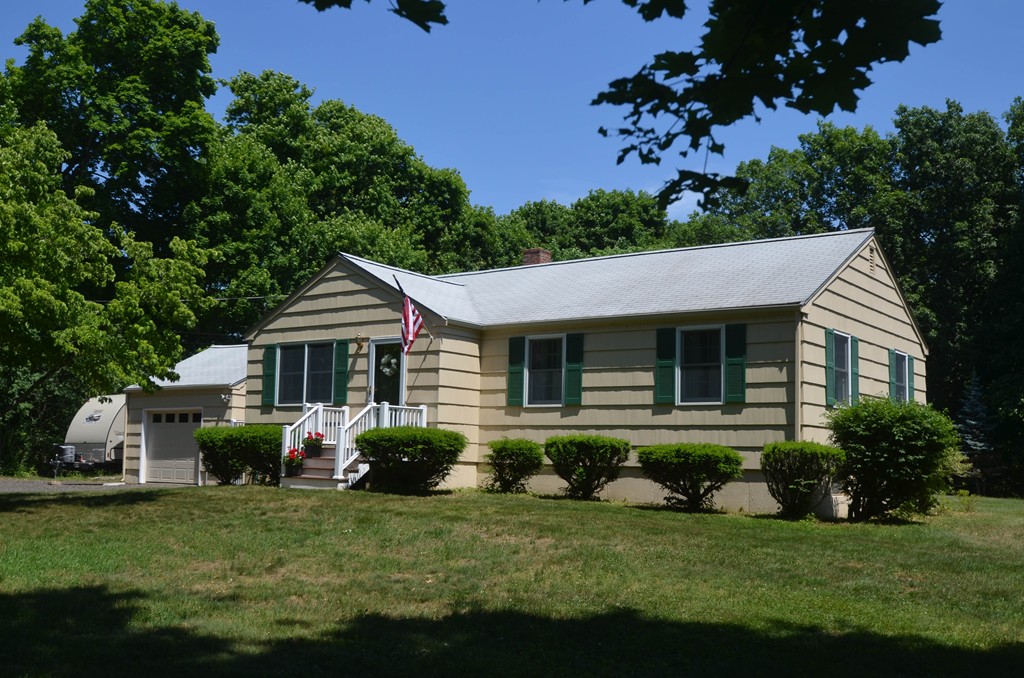 18 Baldpate Road Georgetown, MA 01833 - Photo 1 of 19 a front view of a house with a garden