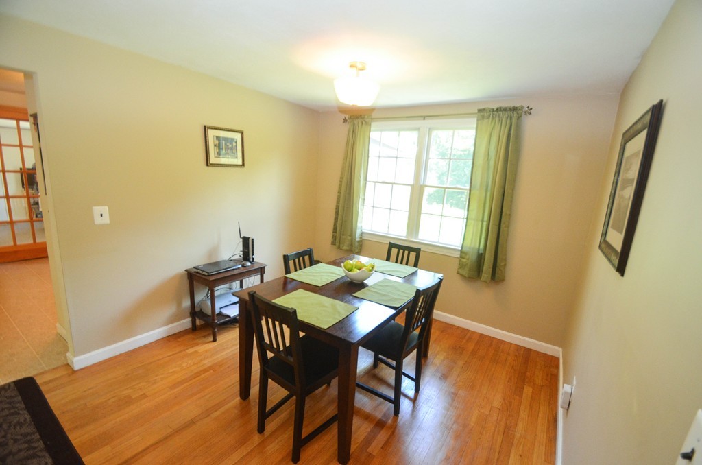 18 Baldpate Road Georgetown, MA 01833 - Photo 11 of 19 a view of a dining room with furniture and wooden floor