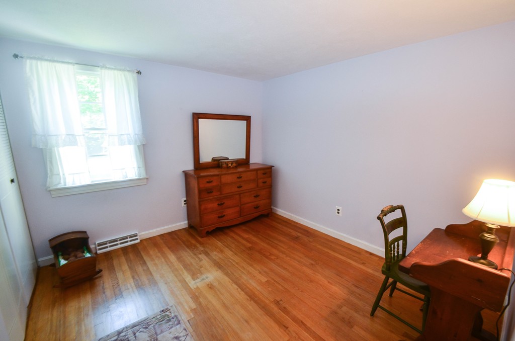 18 Baldpate Road Georgetown, MA 01833 - Photo 16 of 19 a room with wooden floor and windows
