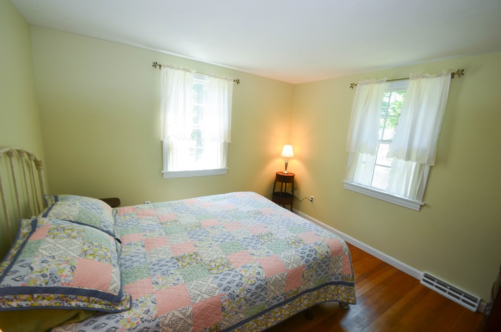 18 Baldpate Road Georgetown, MA 01833 - Photo 17 of 19 a bedroom with a bed and a window