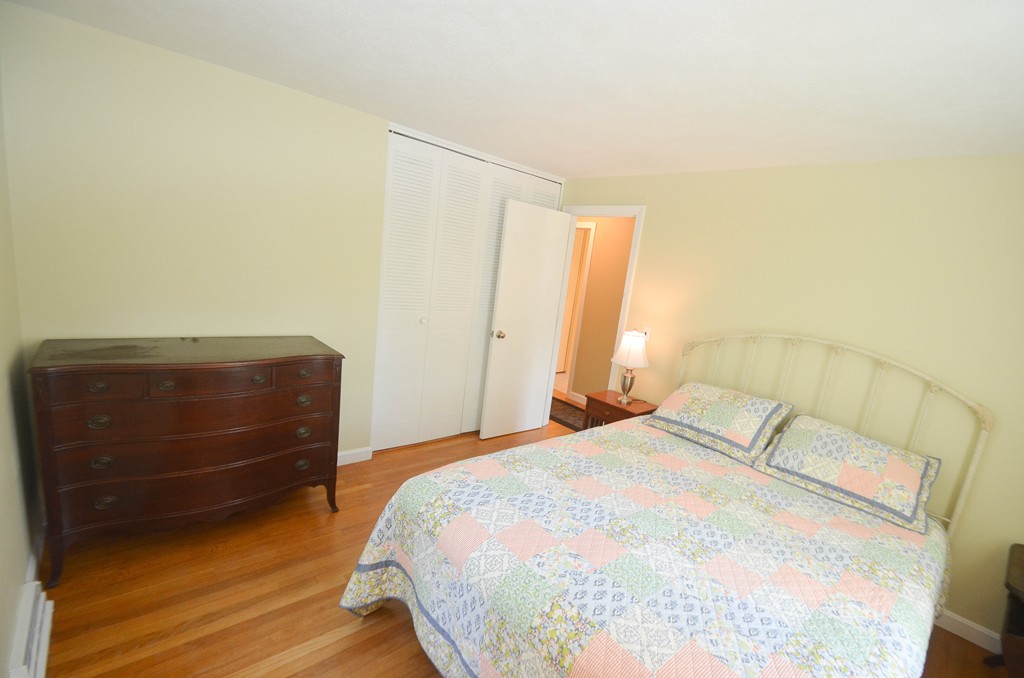 18 Baldpate Road Georgetown, MA 01833 - Photo 18 of 19 a bedroom with a bed and a mirror
