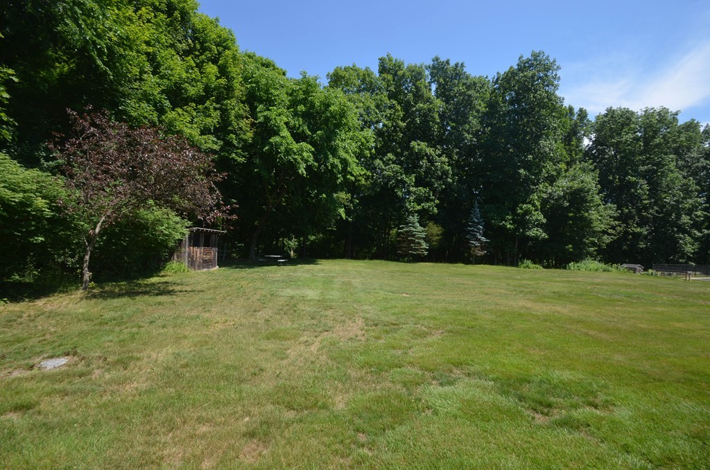 18 Baldpate Road Georgetown, MA 01833 - Photo 4 of 19 a yard with trees in the background
