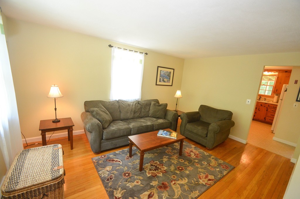 18 Baldpate Road Georgetown, MA 01833 - Photo 6 of 19 a living room with furniture and a wooden floor