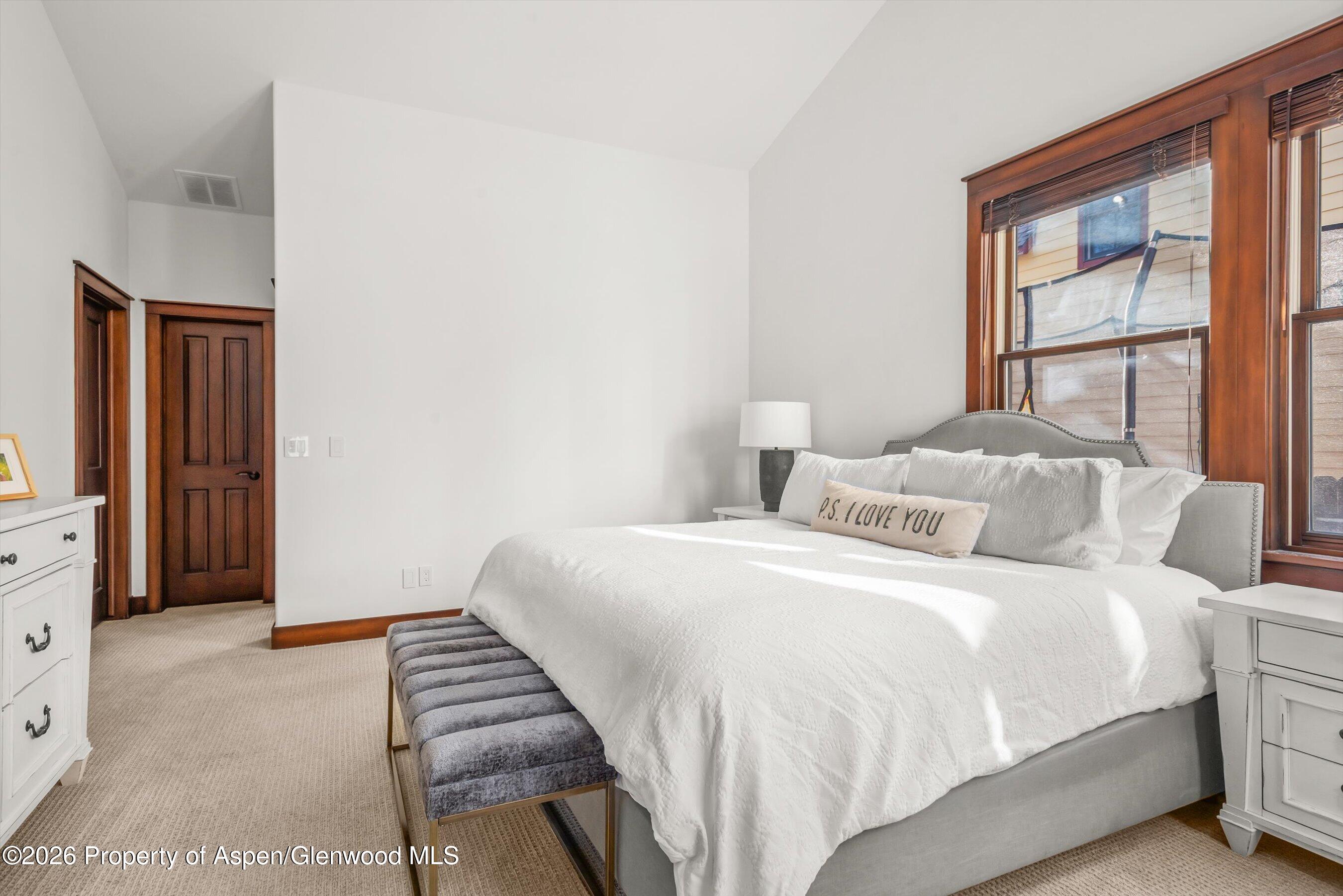 410 Meadow Court Basalt, CO 81621 - Photo 16 of 30 a bedroom with a bed and a window