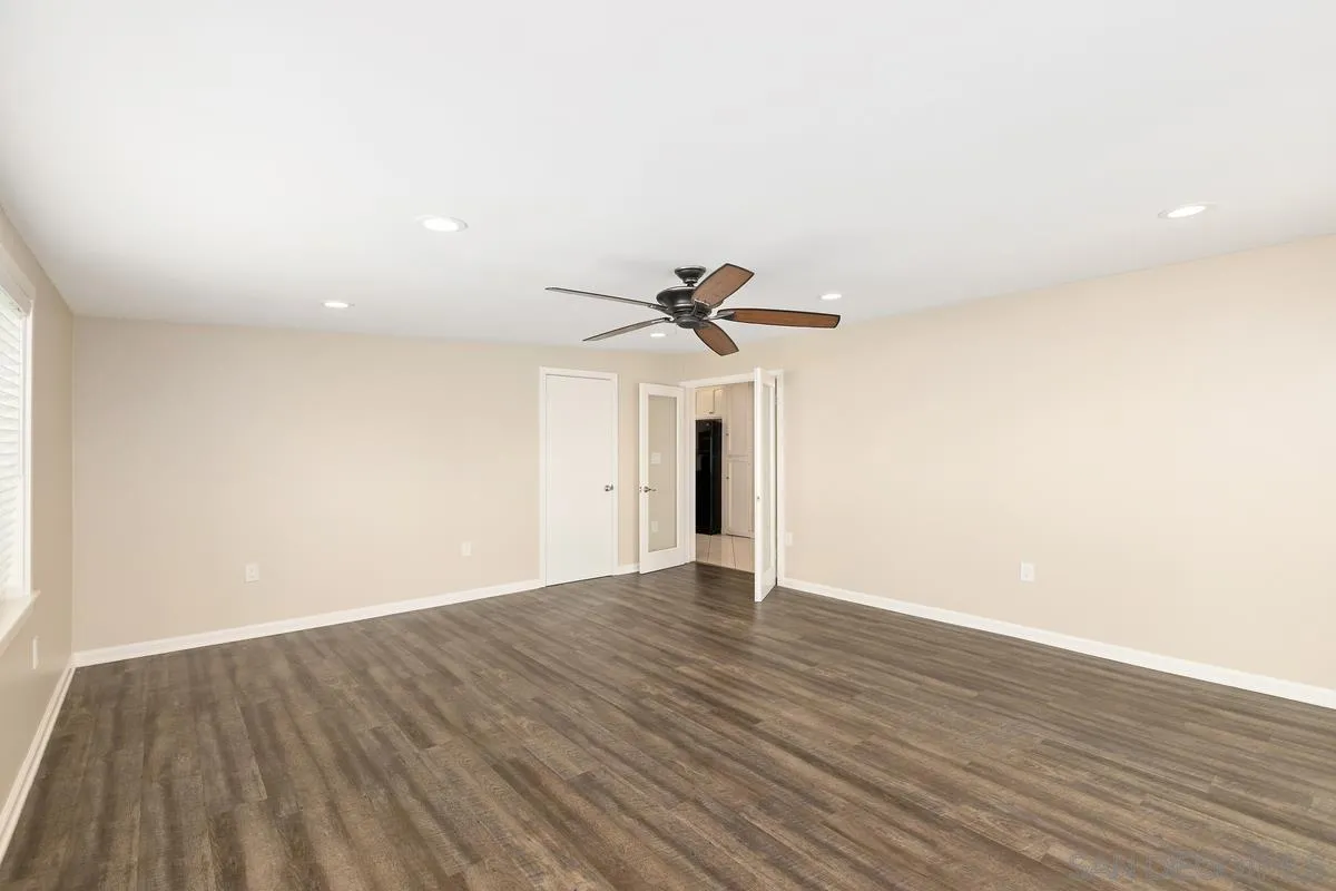 10025 Pinewood View Santee, CA 92071 - Photo 13 of 29 a view of a room with wooden floor and a ceiling fan