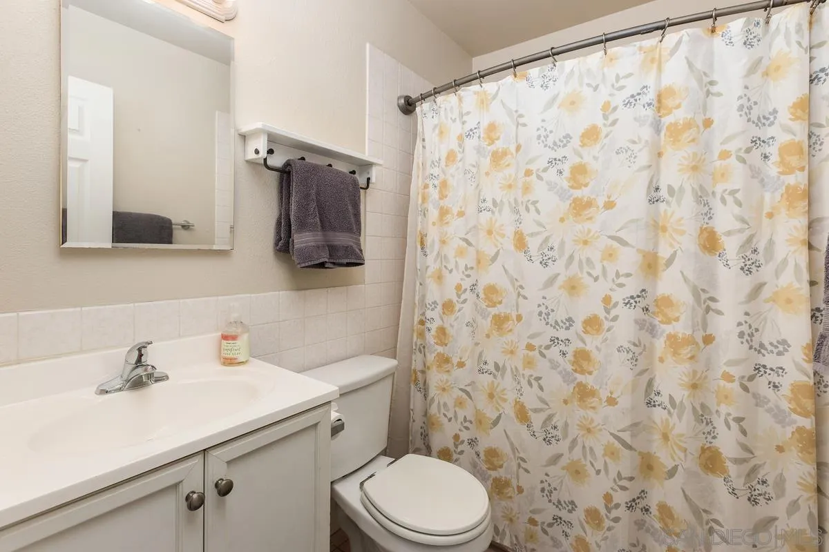 10025 Pinewood View Santee, CA 92071 - Photo 14 of 29 a bathroom with a sink and a toilet