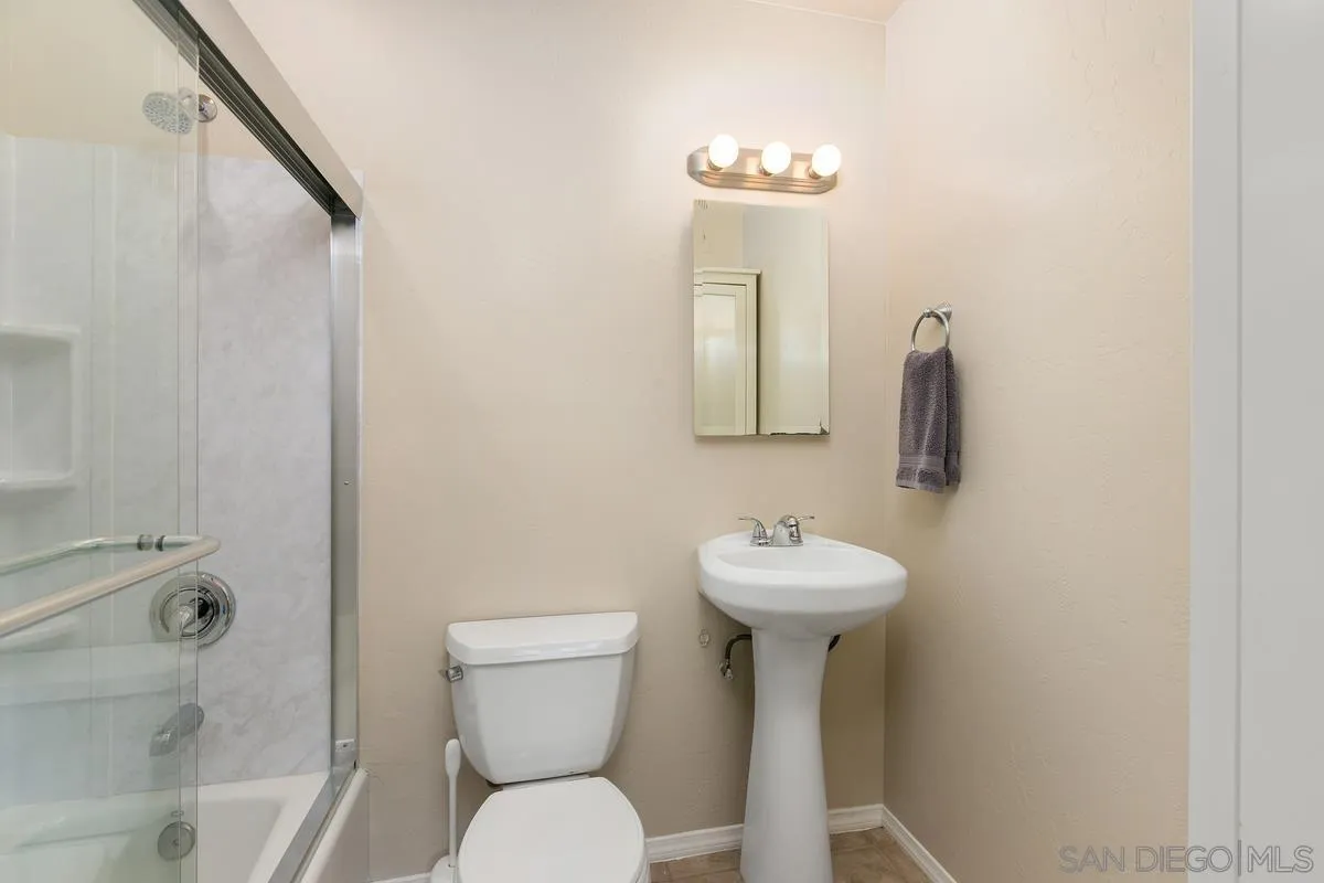 10025 Pinewood View Santee, CA 92071 - Photo 18 of 29 a bathroom with a sink toilet and a mirror