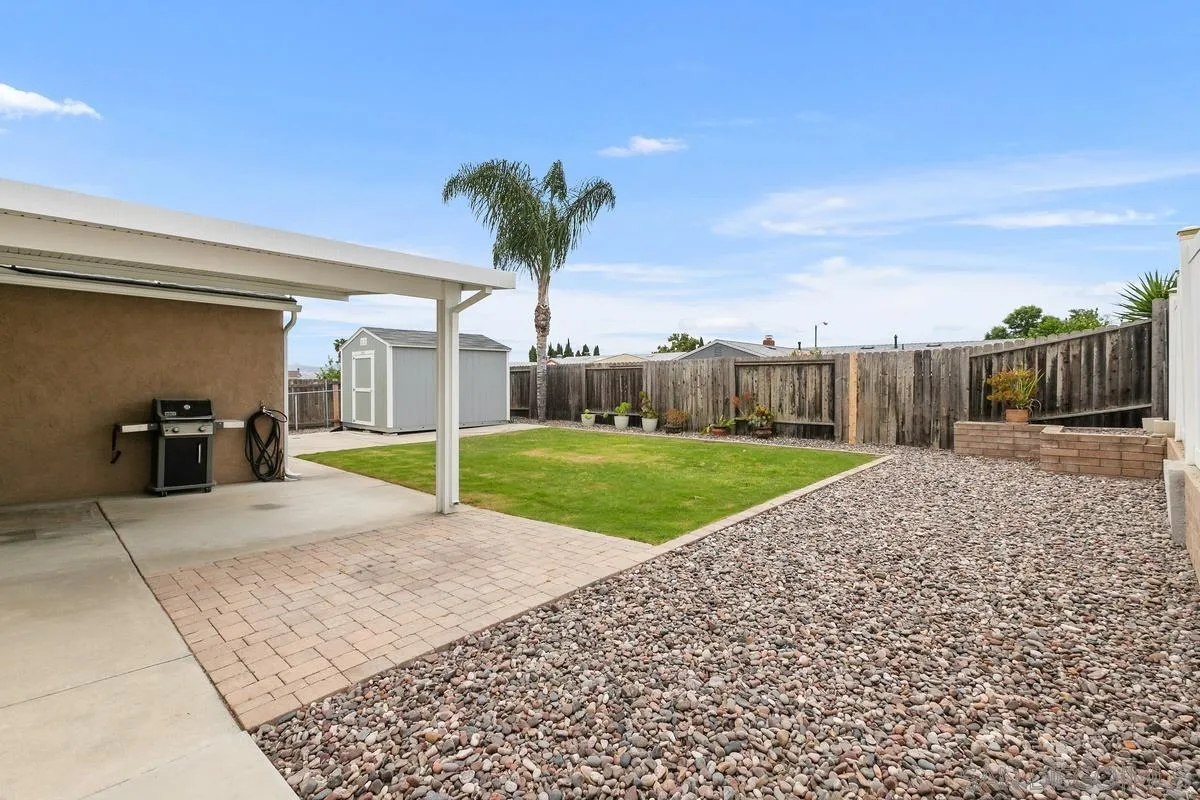 10025 Pinewood View Santee, CA 92071 - Photo 22 of 29 a view of a backyard with a garden