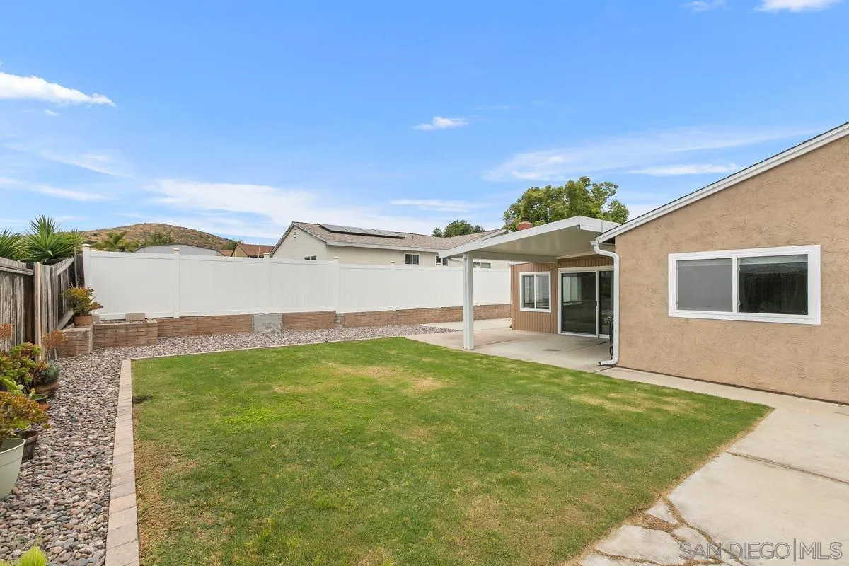 10025 Pinewood View Santee, CA 92071 - Photo 23 of 29 a backyard of a house with table and chairs