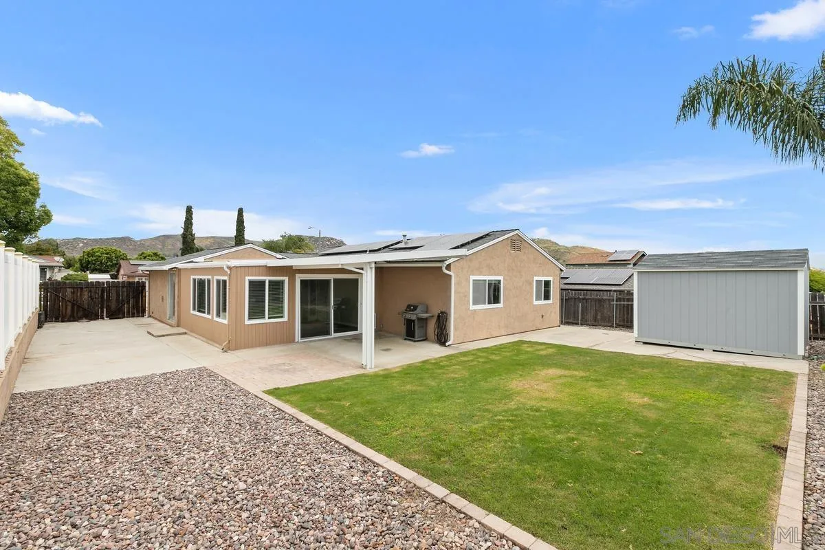 10025 Pinewood View Santee, CA 92071 - Photo 24 of 29 a front view of a house with a yard and potted plants