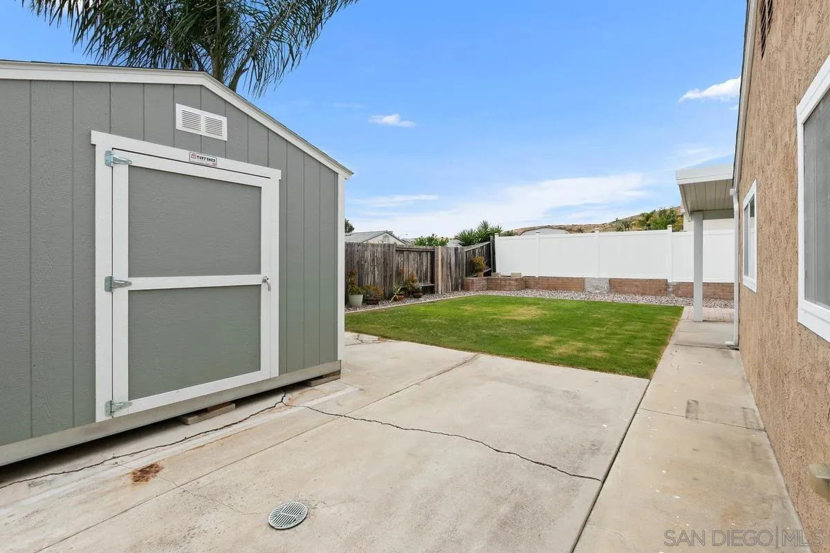 10025 Pinewood View Santee, CA 92071 - Photo 25 of 29 a view of a back yard of the house