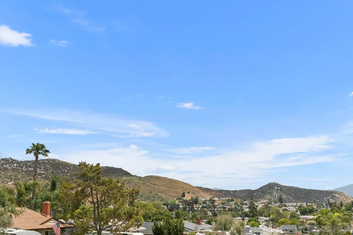 10025 Pinewood View Santee, CA 92071 - Photo 28 of 29 a view of a city with a mountain in the background