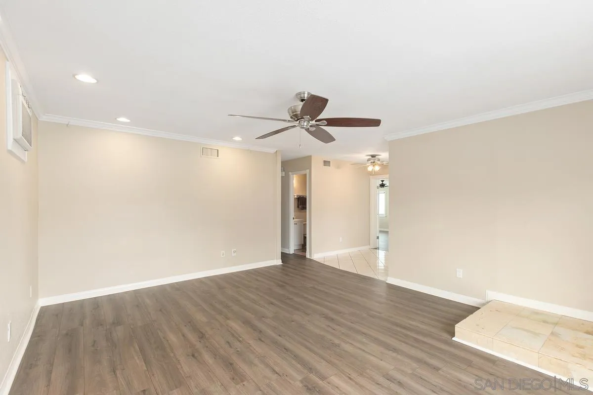 10025 Pinewood View Santee, CA 92071 - Photo 6 of 29 a view of an empty room with wooden floor