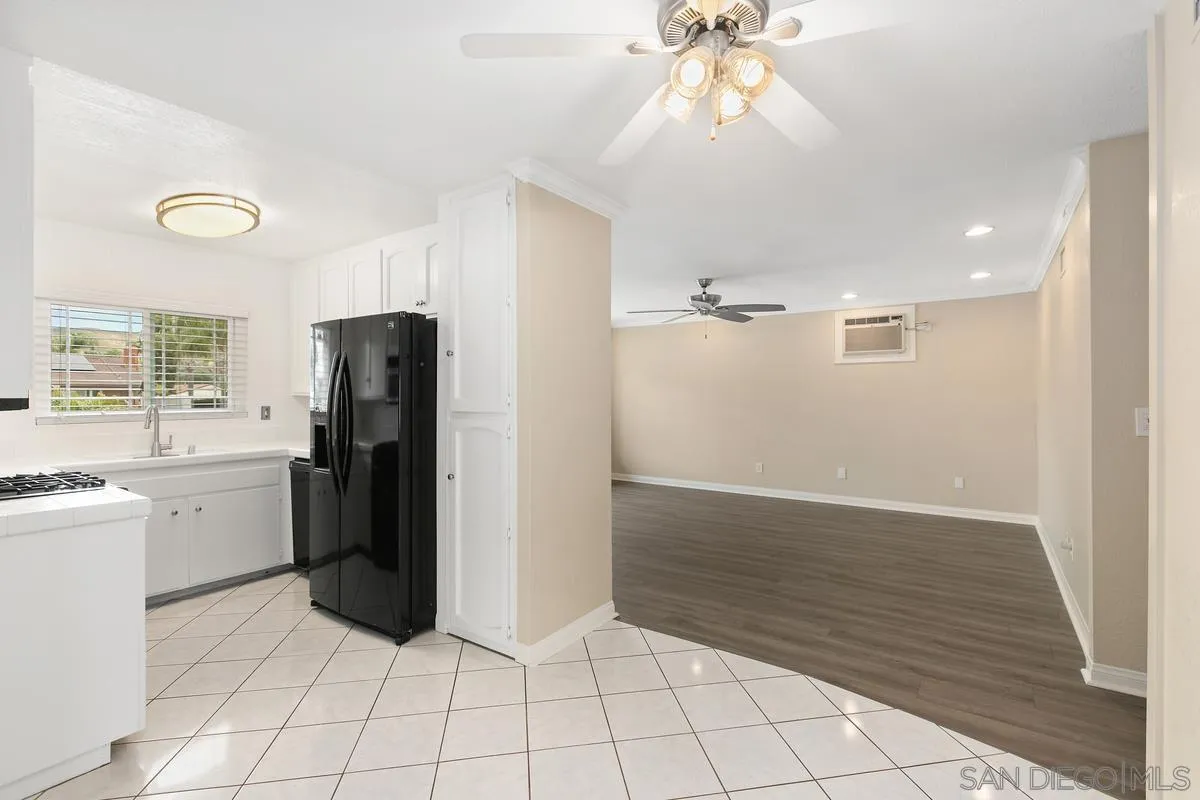 10025 Pinewood View Santee, CA 92071 - Photo 7 of 29 a view of a kitchen with refrigerator and cabinet