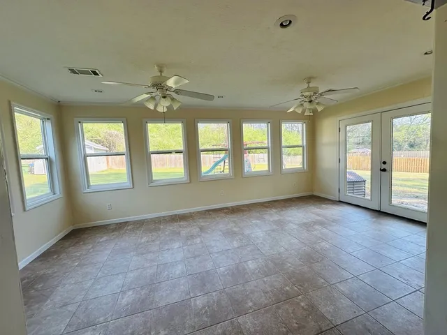 a view of an empty room with a window
