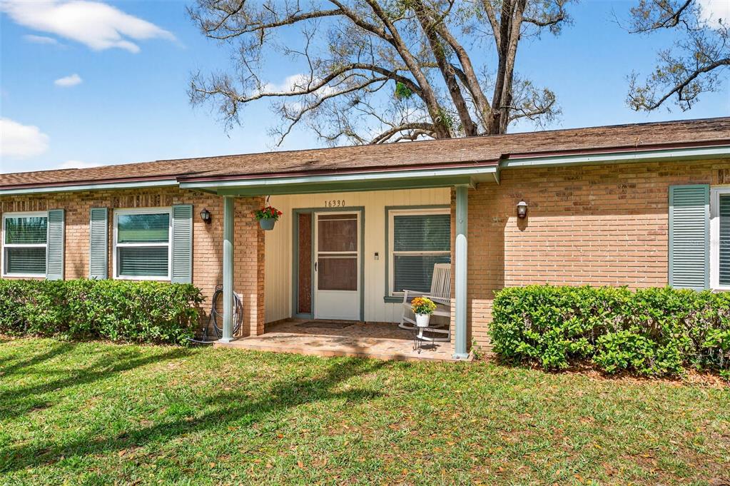 16330 Hanna Road Lutz, FL 33549 - Photo 1 of 41 front view of a house with a large window