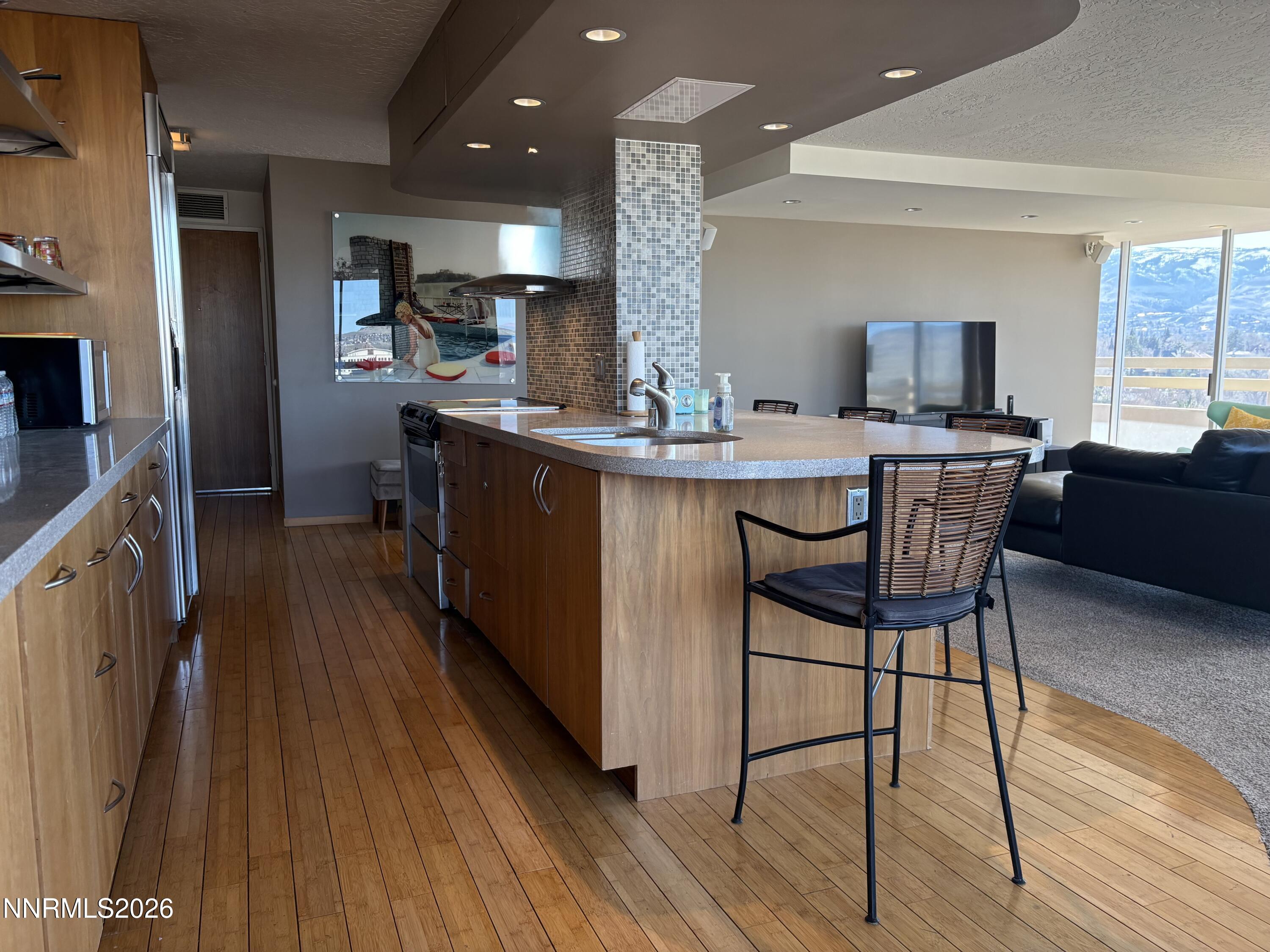 100 North Arlington Avenue, Unit 8J Reno, NV 89501 - Photo 6 of 17 6 Kitchen frnt door