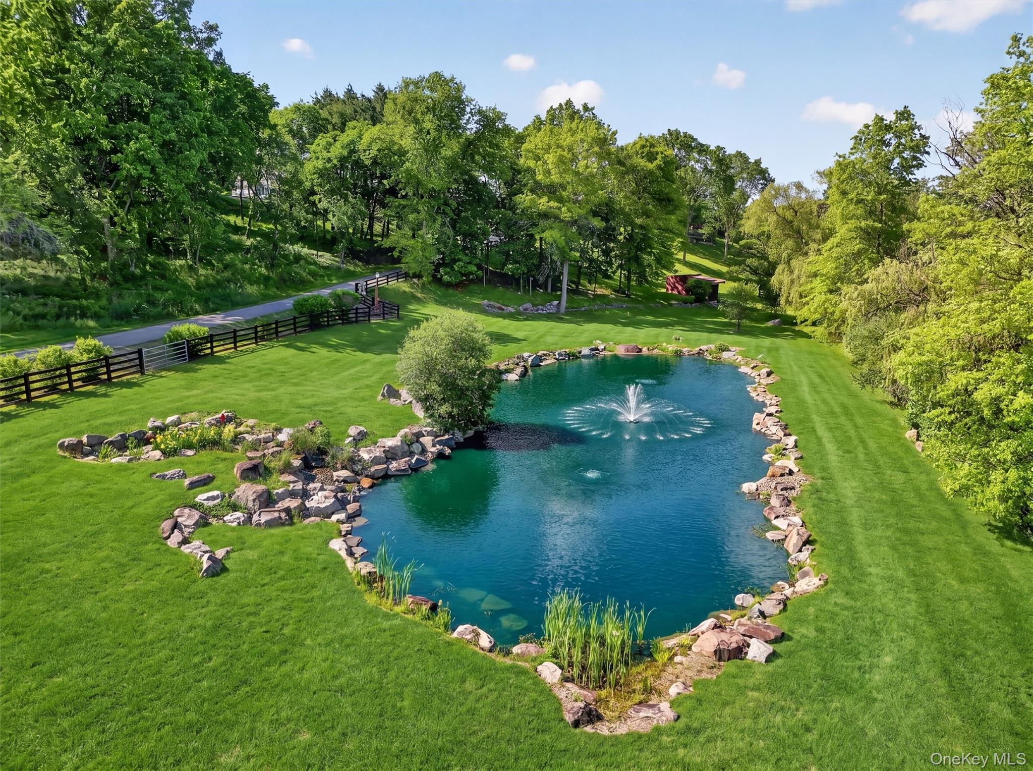 165 Hasbrouck Road Goshen, NY 10924 - Photo 35 of 50 The largest of 3 koi ponds creates a park like feeling as you enter the property