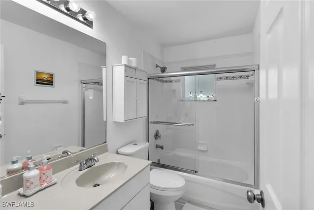 a bathroom with a sink toilet tub and shower