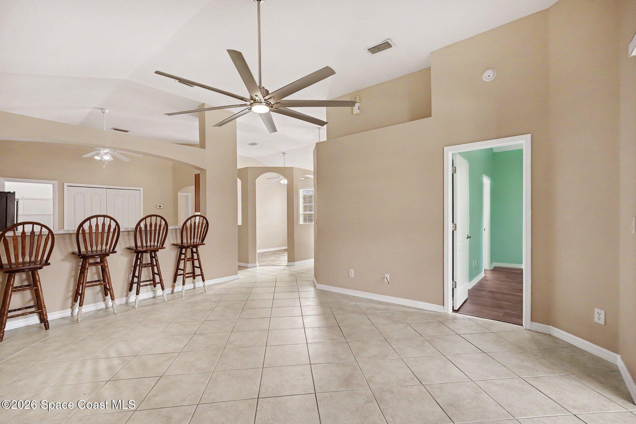 284 Intrepid Way Indialantic, FL 32903 - Photo 12 of 36 a view of a livingroom with a chandelier furniture and a ceiling fan