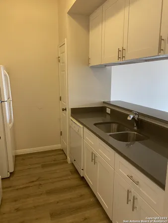a kitchen with a sink and cabinets