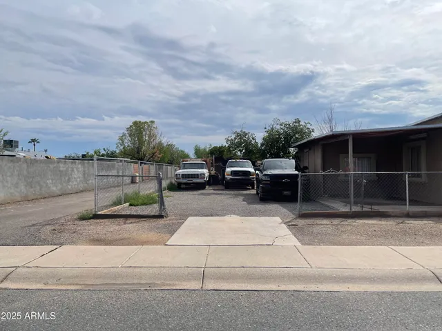a view of yard with car parked