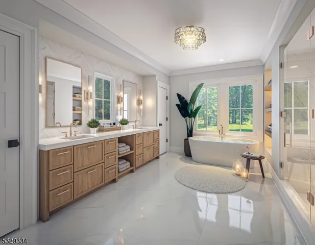 a spacious bathroom with a granite countertop sink and a mirror