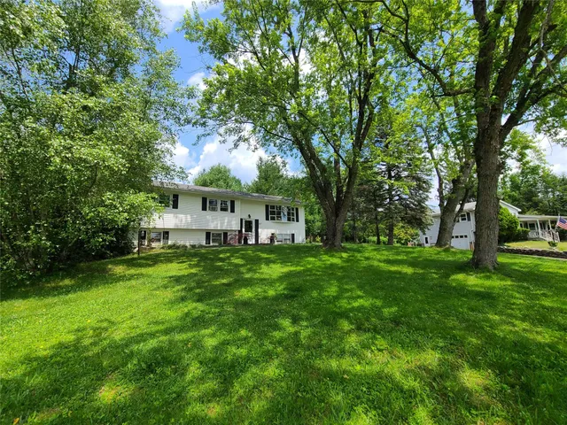 a backyard of a house with lots of green space