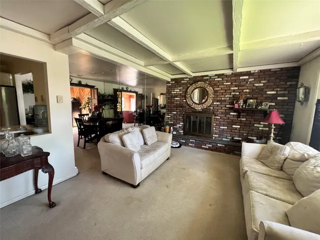 a living room with furniture and a clock