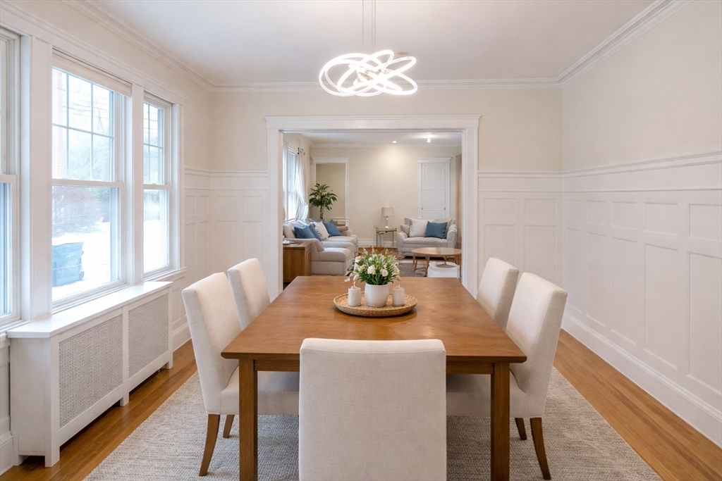 446 Lowell Avenue, Unit 446 Newton, MA 02460 - Photo 11 of 15 a view of a dining room with furniture window and wooden floor