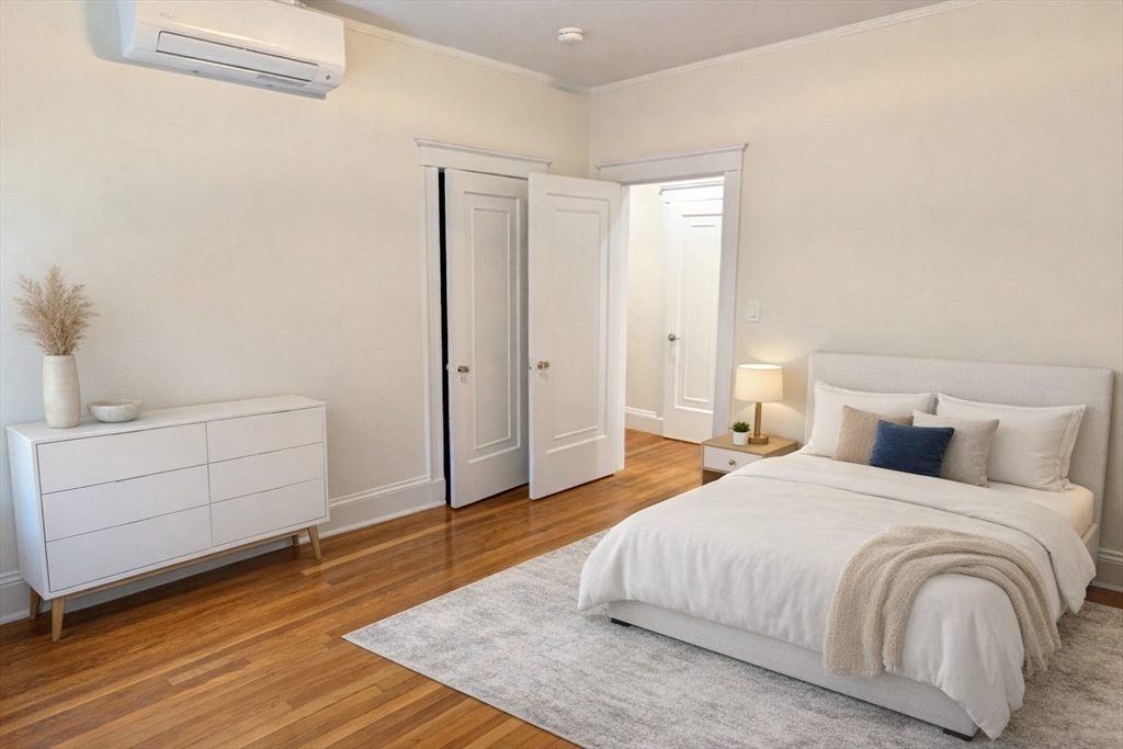 446 Lowell Avenue, Unit 446 Newton, MA 02460 - Photo 12 of 15 a bedroom with a bed and a window