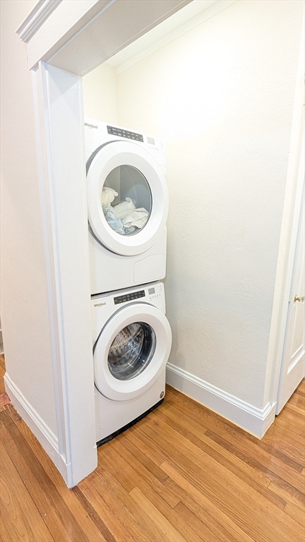 446 Lowell Avenue, Unit 446 Newton, MA 02460 - Photo 13 of 15 a utility room with washing machine and a view of bedroom