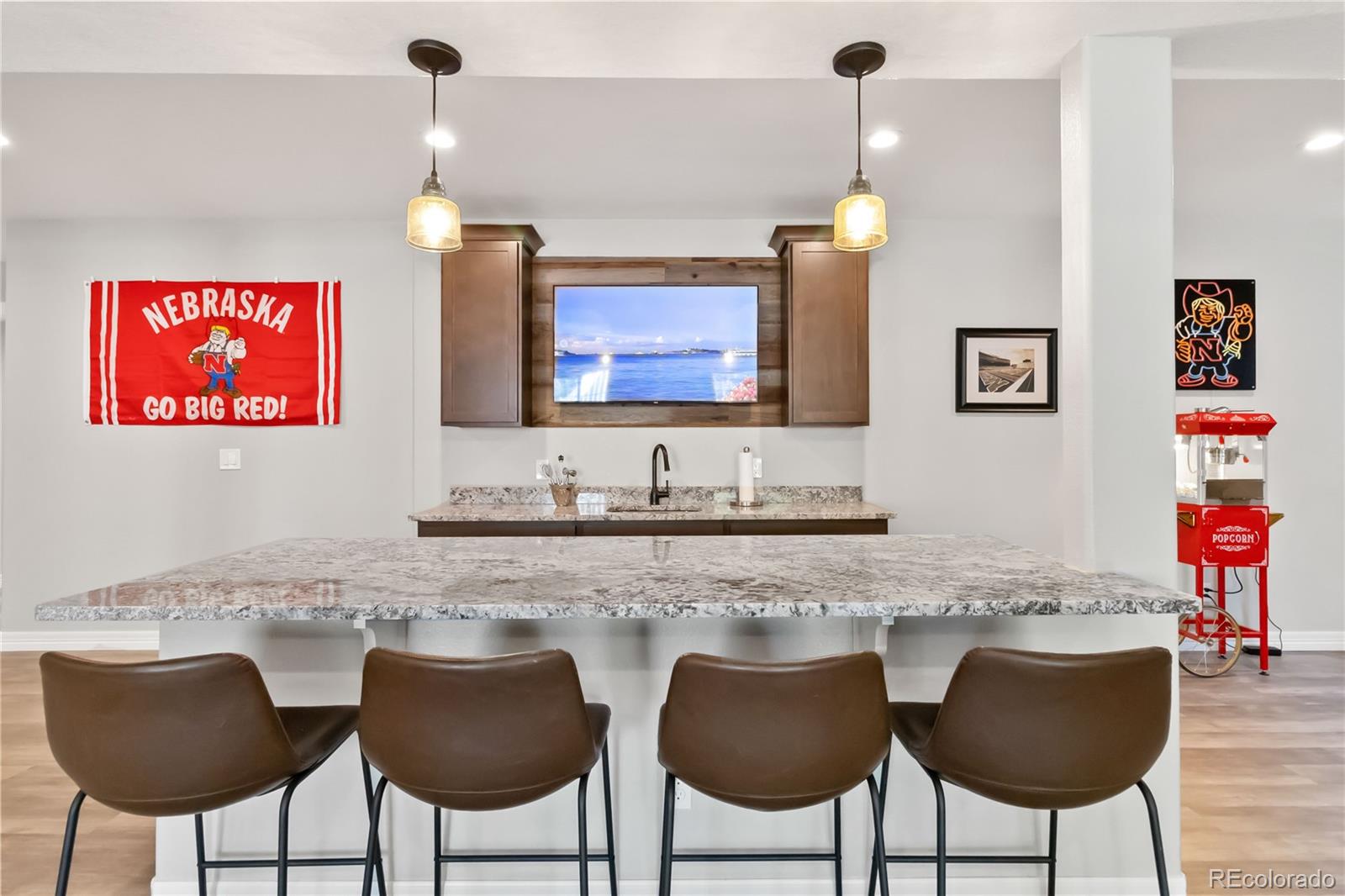 3034 Mashie Circle Castle Rock, CO 80109 - Photo 17 of 50 a kitchen with stainless steel appliances granite countertop a sink and a refrigerator