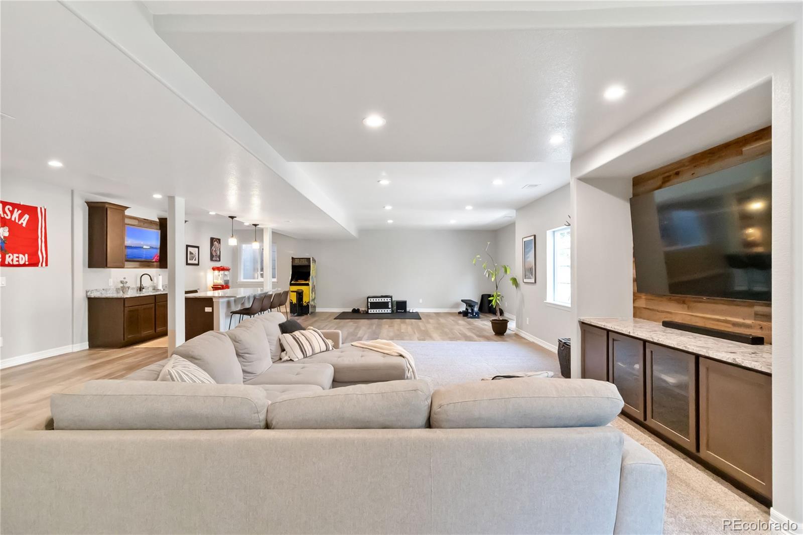 3034 Mashie Circle Castle Rock, CO 80109 - Photo 20 of 50 a living room with furniture kitchen view and a flat screen tv