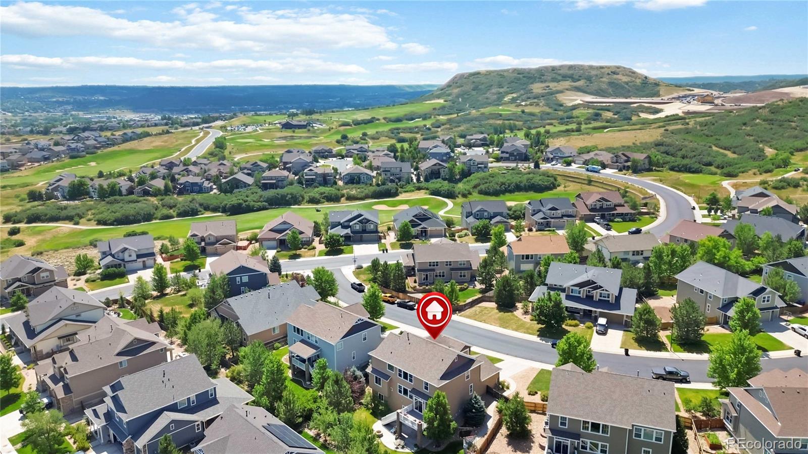 3034 Mashie Circle Castle Rock, CO 80109 - Photo 2 of 50 an aerial view of lake and residential houses with outdoor space