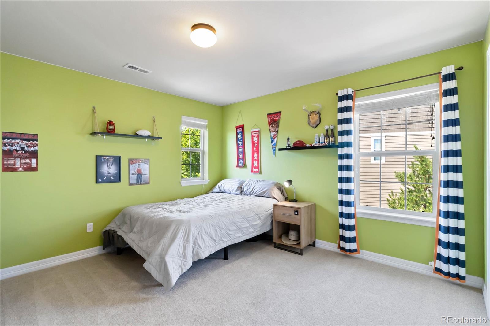 3034 Mashie Circle Castle Rock, CO 80109 - Photo 29 of 50 a bedroom with a bed and a window