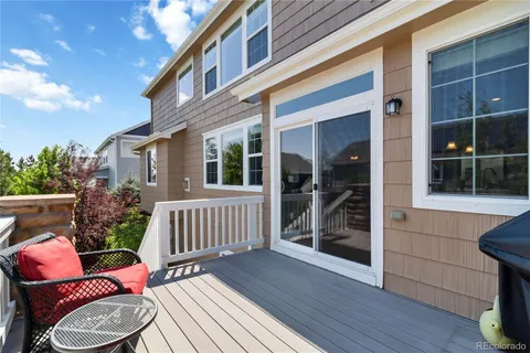 a outdoor space with lots of chairs and plants