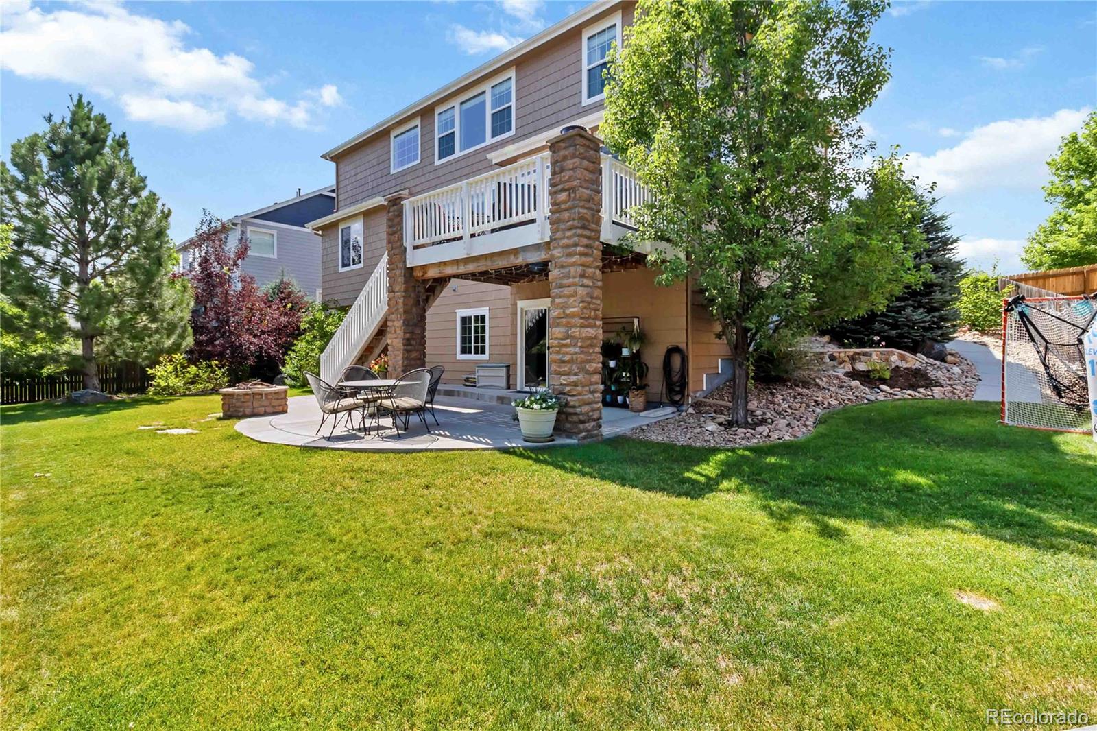 3034 Mashie Circle Castle Rock, CO 80109 - Photo 38 of 50 a view of a building with a yard