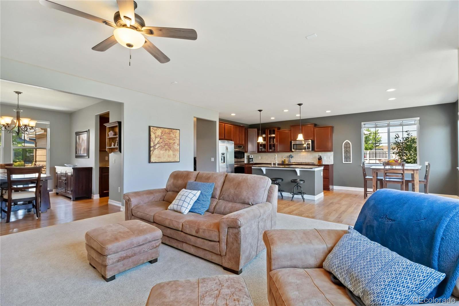 3034 Mashie Circle Castle Rock, CO 80109 - Photo 5 of 50 a living room with furniture kitchen view and a large window