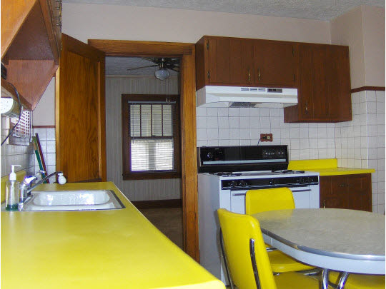 520 Brooke Road Rockford, IL 61109 - Photo 7 of 9 a kitchen with a table chairs and a stove
