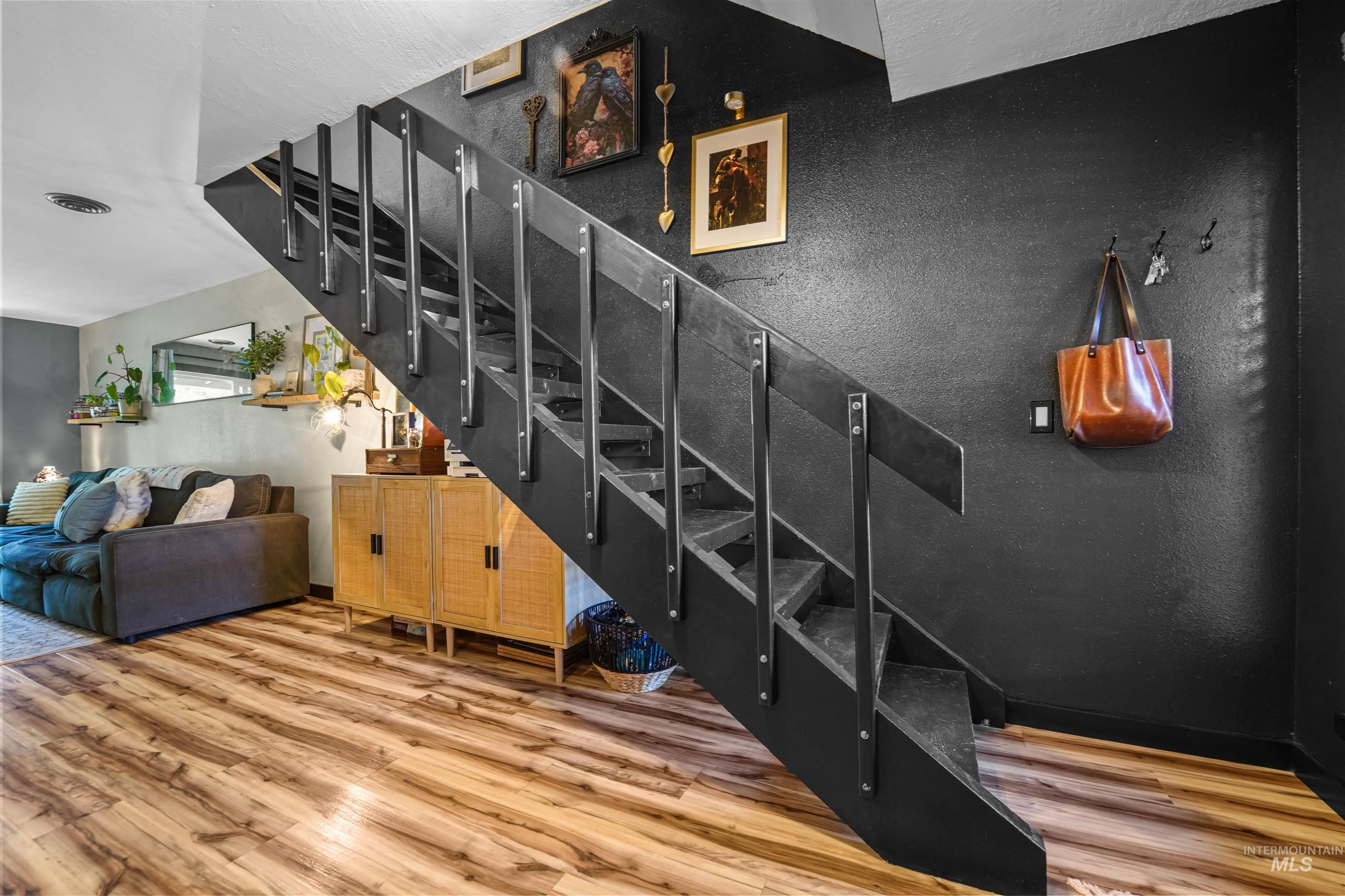 348 North Eagle Road Eagle, ID 83616 - Photo 8 of 31 Staircase featuring wood finished floors