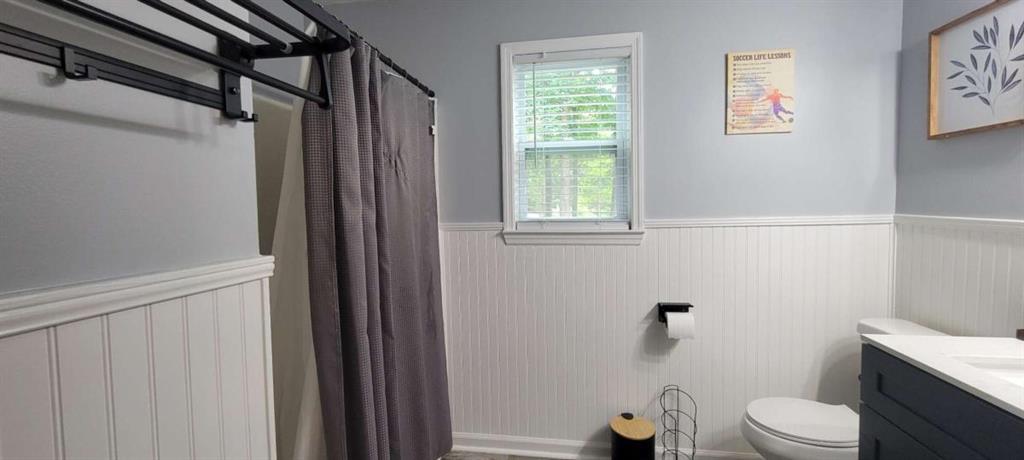 2140 Summerset Drive Monroe, GA 30656 - Photo 22 of 43 a bathroom with a toilet and a shower