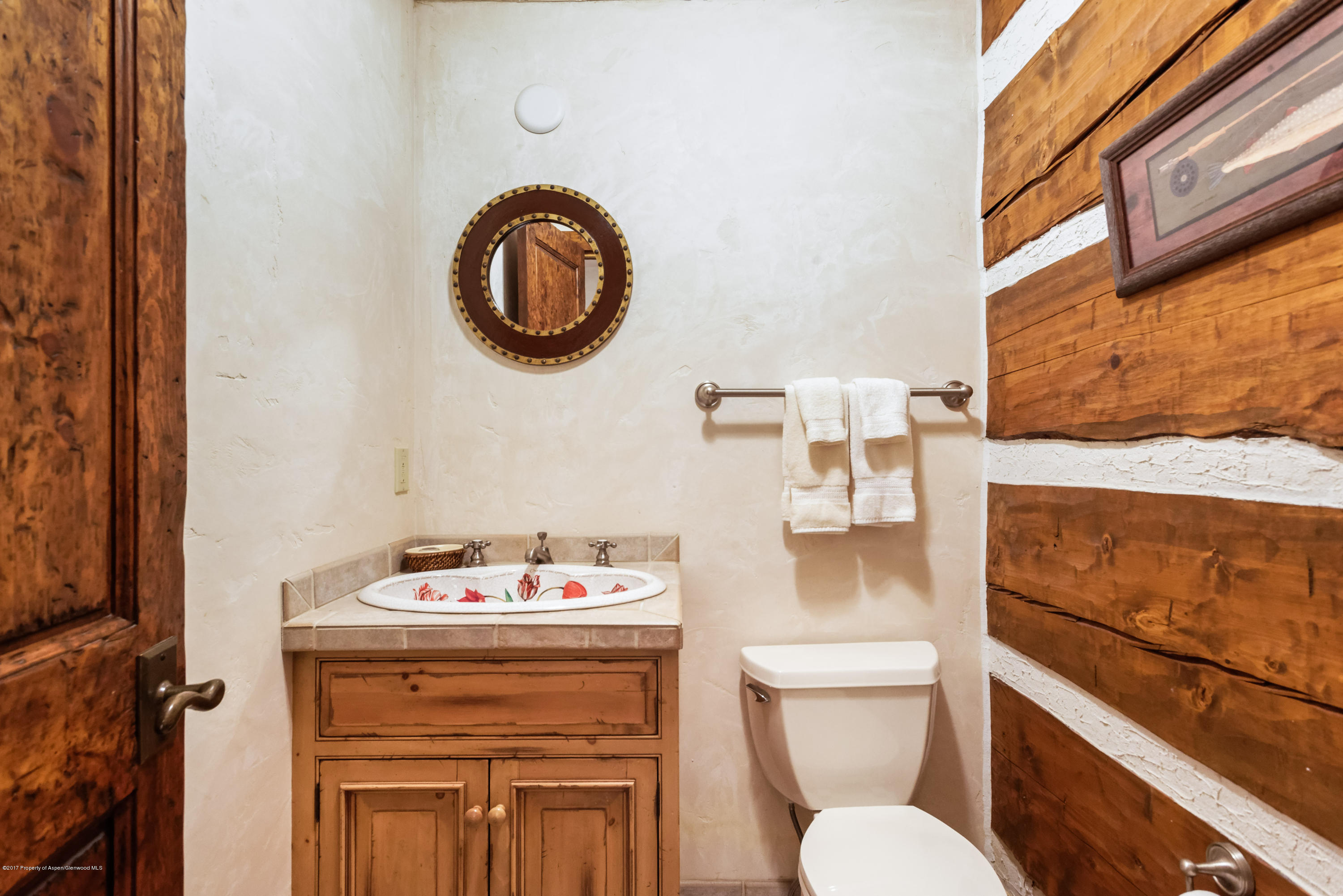 39 Altamira Ranch Road, Unit CABIN 39 Basalt, CO 81621 - Photo 14 of 23 a bathroom with a toilet a sink and a mirror