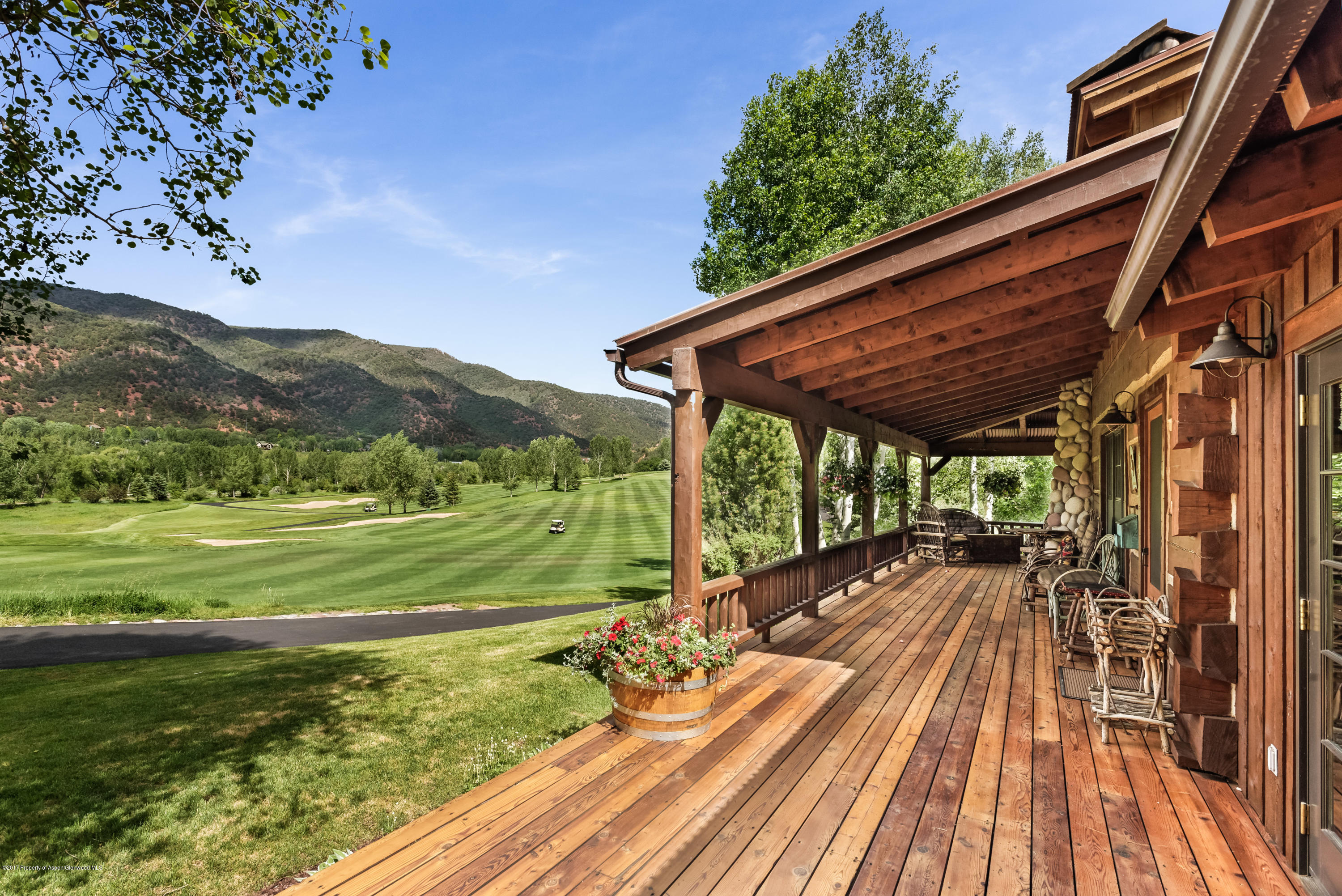 39 Altamira Ranch Road, Unit CABIN 39 Basalt, CO 81621 - Photo 18 of 23 a view of a backyard with wooden floor and lake view