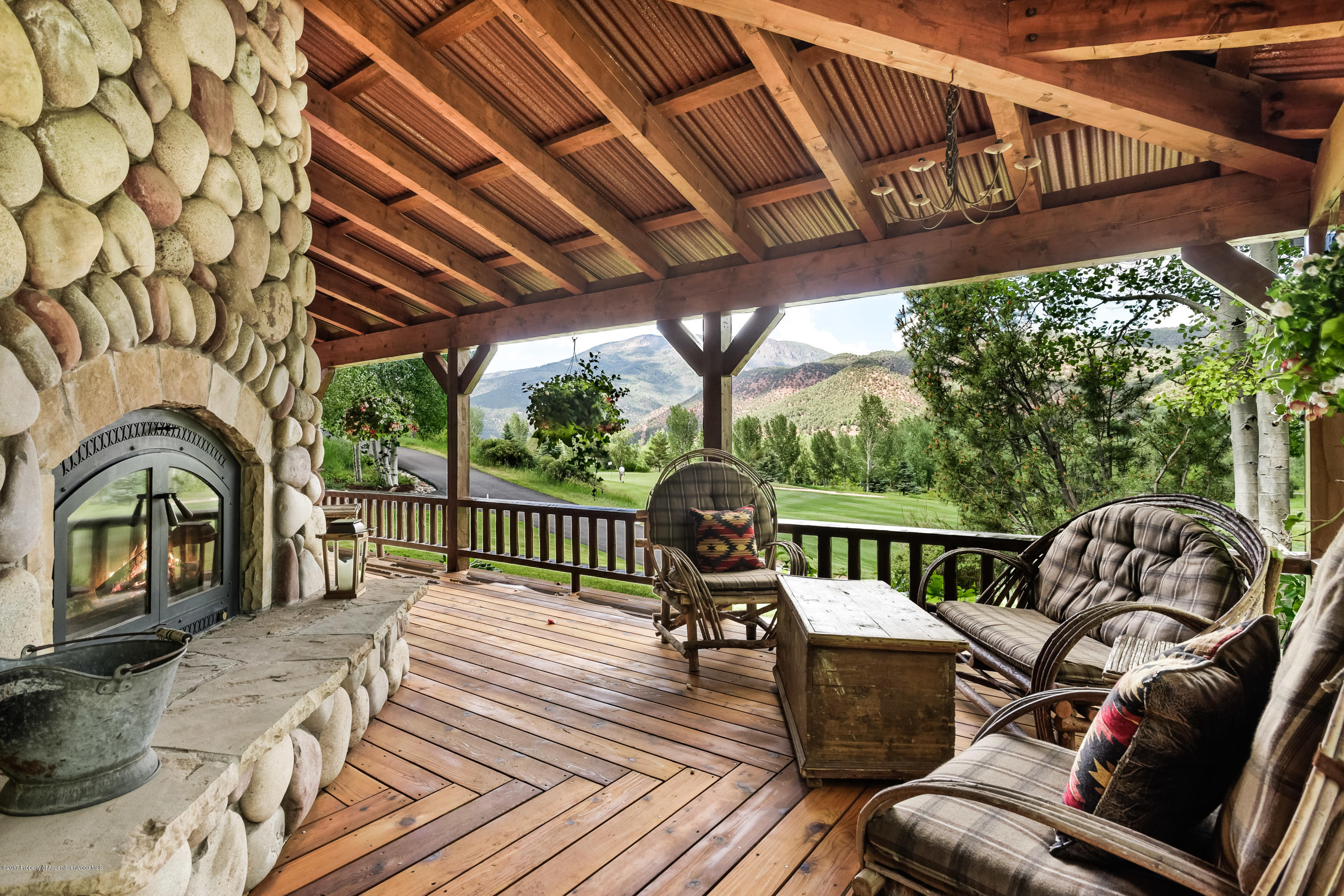 39 Altamira Ranch Road, Unit CABIN 39 Basalt, CO 81621 - Photo 2 of 23 a view of a chairs in patio